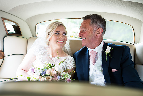Father and daughter in the wedding car